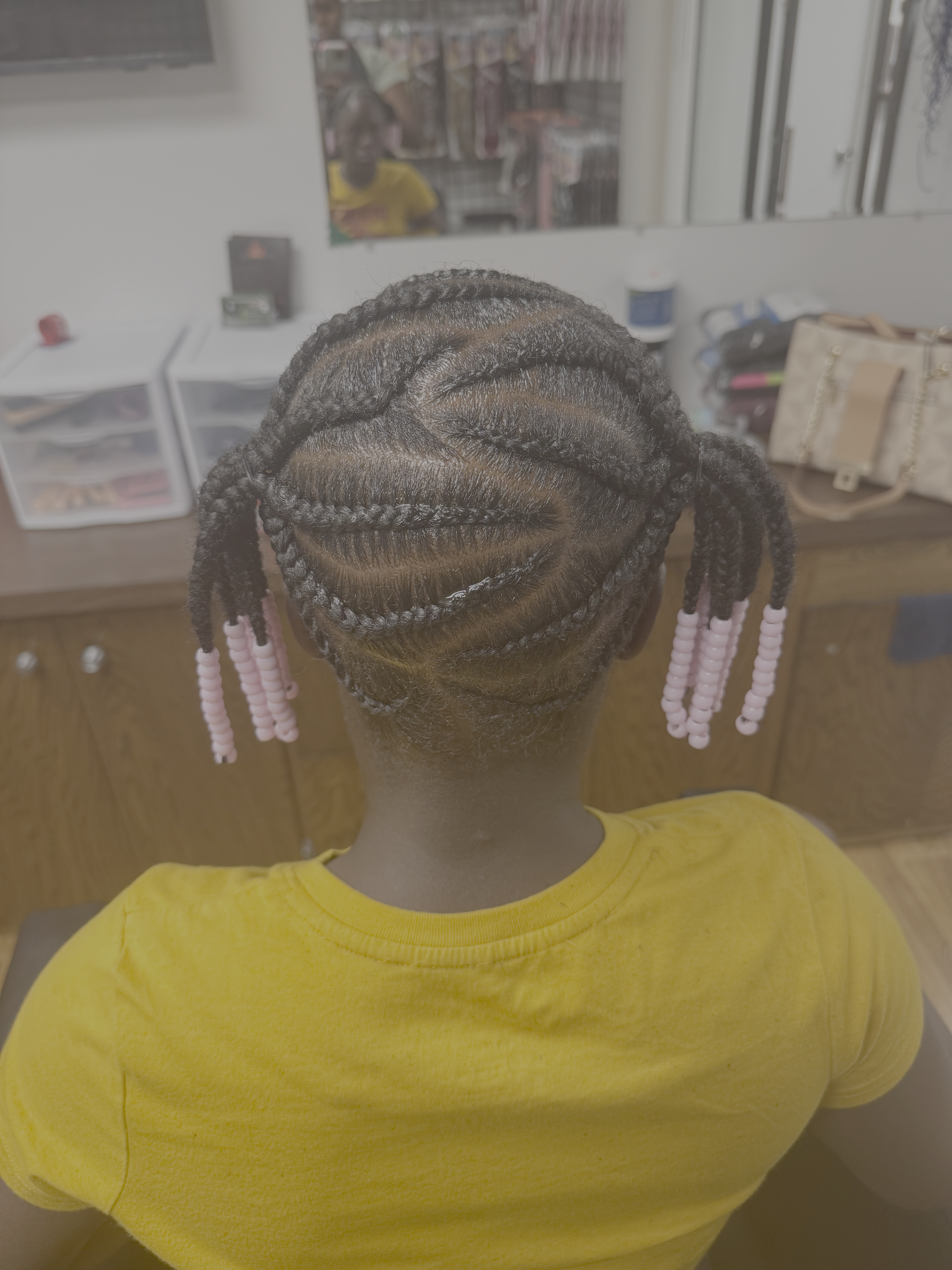 Welcoming salon interior with skilled stylists working on beautiful natural hair
