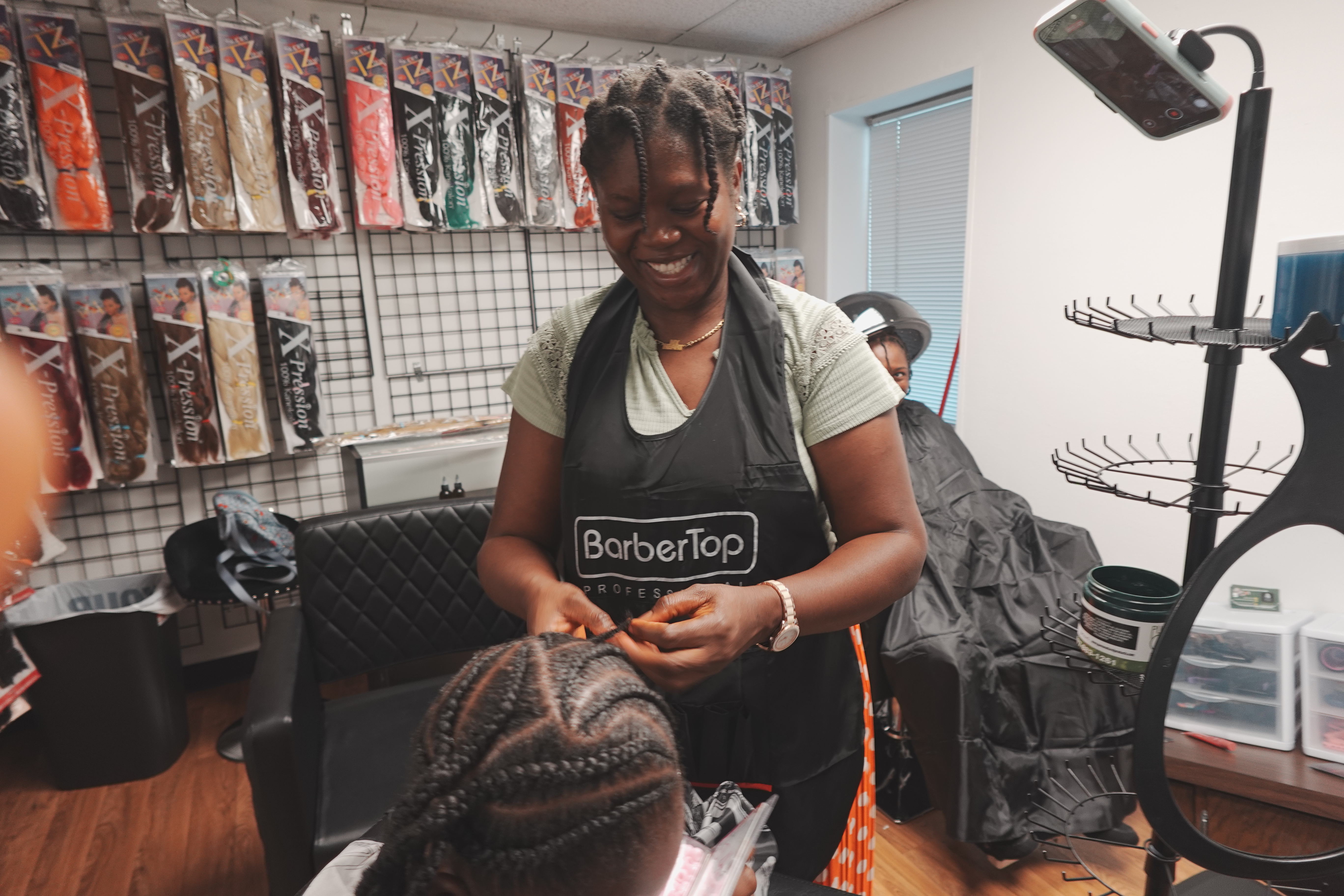 Diverse family getting hair styled together