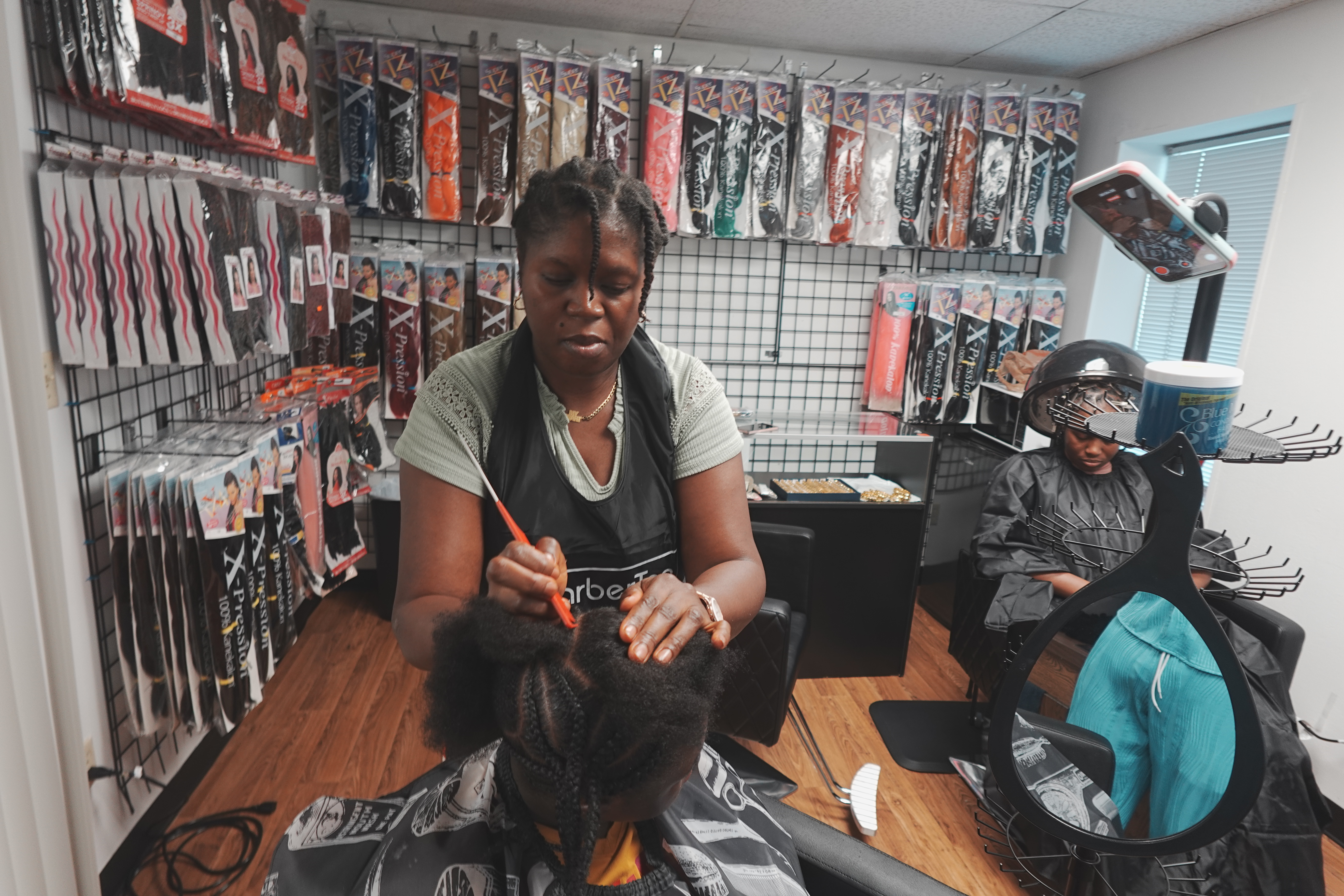 Diverse family getting hair styled together