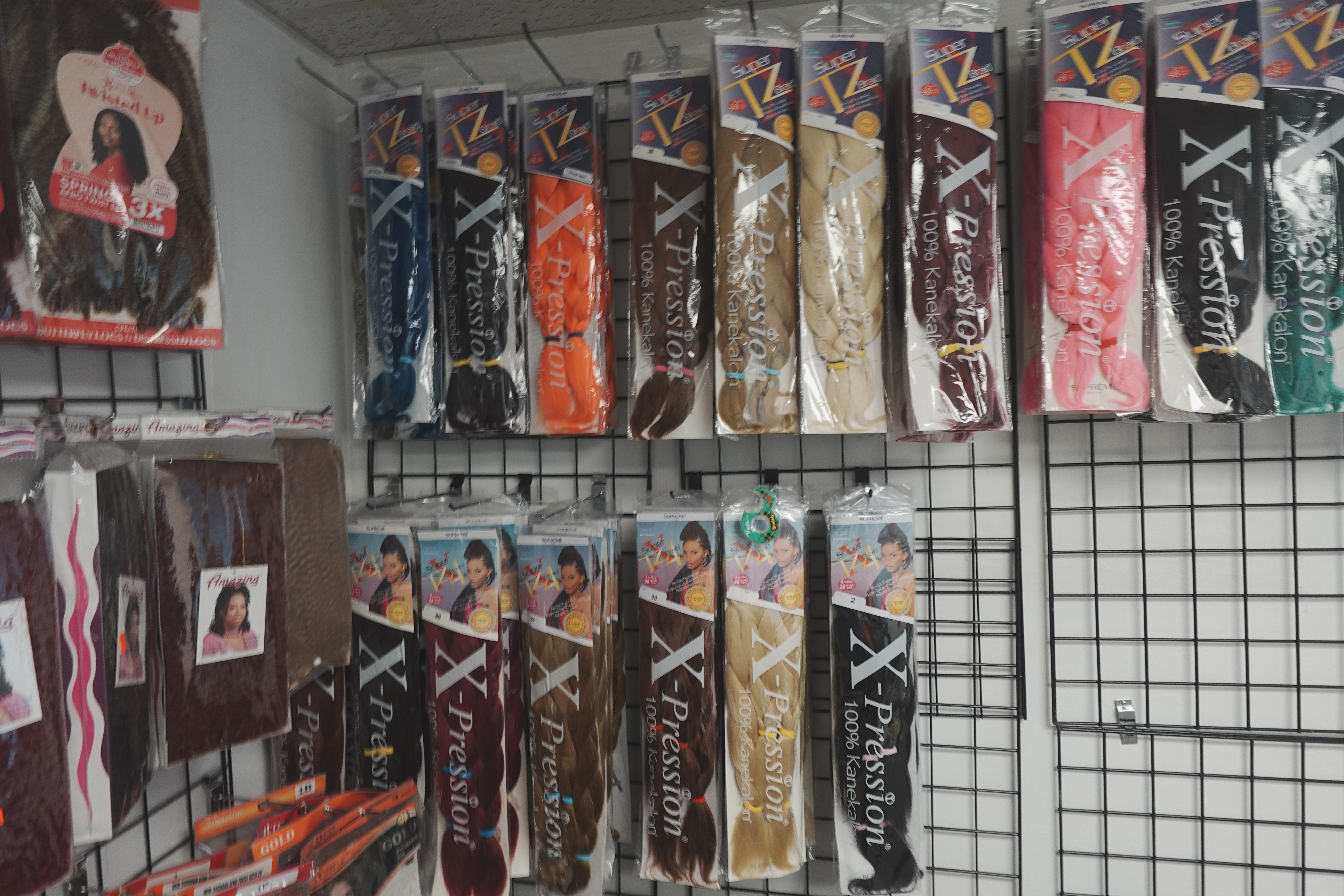 High-quality hair extensions, wigs, and attachments display